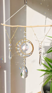 DIY driftwood moon and star crystal suncatcher