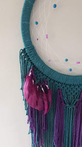 Peacock coloured moon catcher with pretty feathers