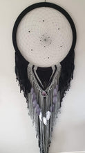 Load image into Gallery viewer, Handmade black and grey dreamcatcher with crystal and feather detail.